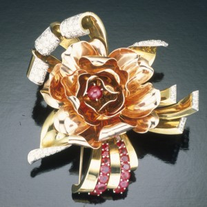 Trabert & Hoeffier Mauboussin rose brooch. Center stone in brooch is a star ruby. Courtesy of GIA & Tino Hammid.