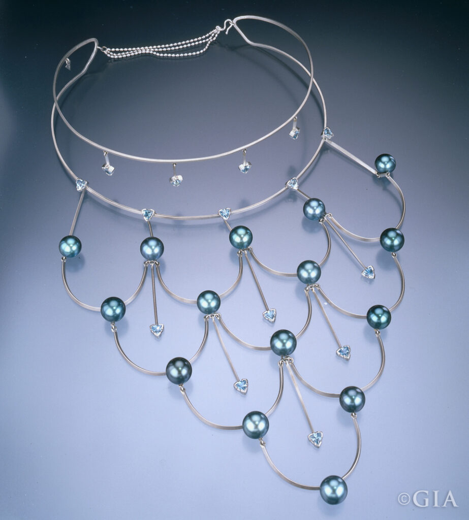 This platinum, Tahitian cultured pearl and aquamarine necklace by Holly K. Croft won third place in the 2001 AGTA Spectrum Awards as well as the Platinum Honors Division of the Awards.