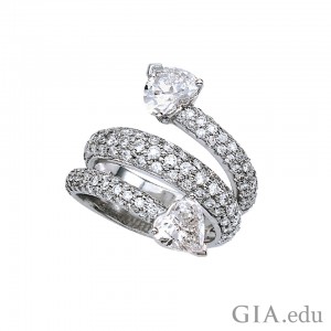Fusaro Jewelry Co. wrap ring featuring two heart shaped diamonds and pavé set diamonds in platiunum. Courtesy: Platinum Guild International
