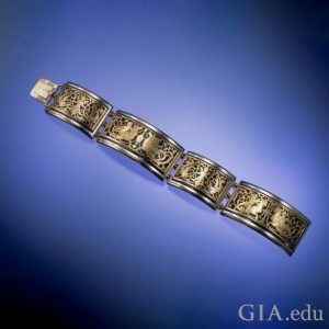 Gold and dark blue enameled bracelet signed “Tissot for Boucheron”.
