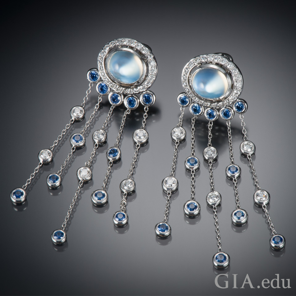 Platinum earrings featuring moonstones, diamonds and Montana sapphires