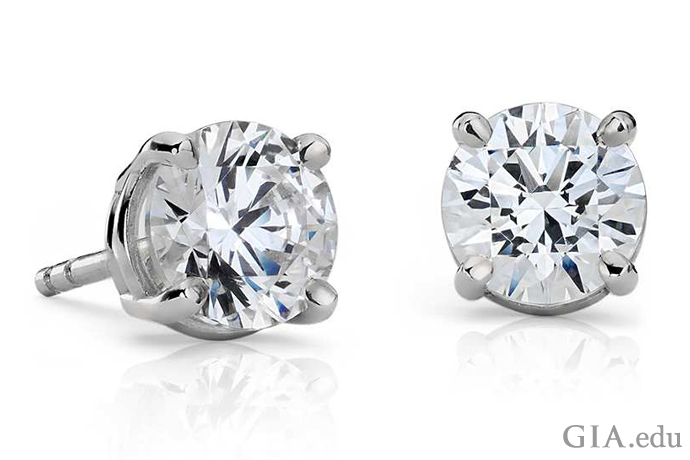These four-prong platinum earrings feature GIA-graded E-color diamonds with a clarity grade of VVS1.