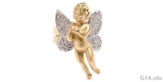 Cupid is the adorable child in this 18K gold ring with wings studded with 1.90 carats of diamonds.