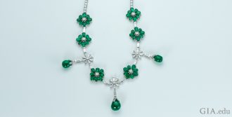An emerald and diamond necklace totaling 41.97 carats