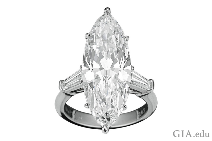 A 8.03 ct D-color marquise diamond flanked by two baguette diamond accents