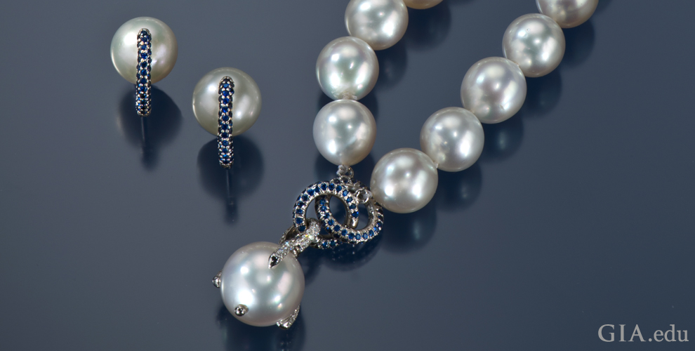 Semi-round South Sea cultured pearl necklace with blue sapphire accents