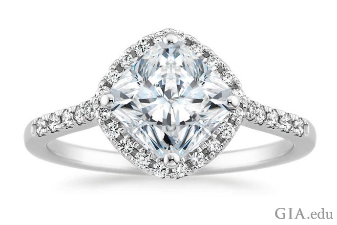 Radiant cut center stone with round brilliant cut diamonds.