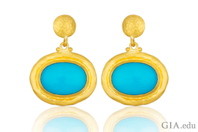 Rich blue turquoise surrounded by 24K gold makes these earrings a mesmerizing sight.