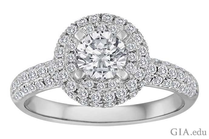 A 6.75 carat round brilliant cut diamond engagement ring featuring a diamond melee halo and band. 