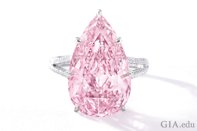 An 8.41 ct Fancy Vivid purple-pink pear shaped diamond ring.