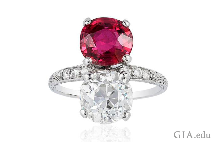 A vintage engagement ring featuring a 3.03 carat old European cut diamond and a 3.01 carat ruby.