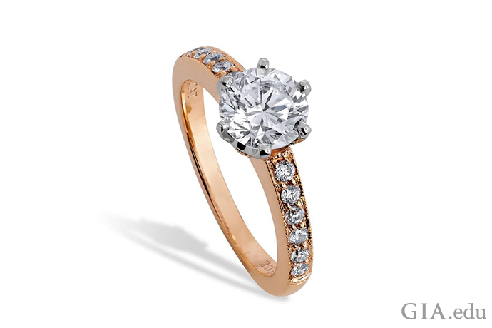 A 1.40 carat diamond engagement ring with 0.20 carats of melee set in rose gold.