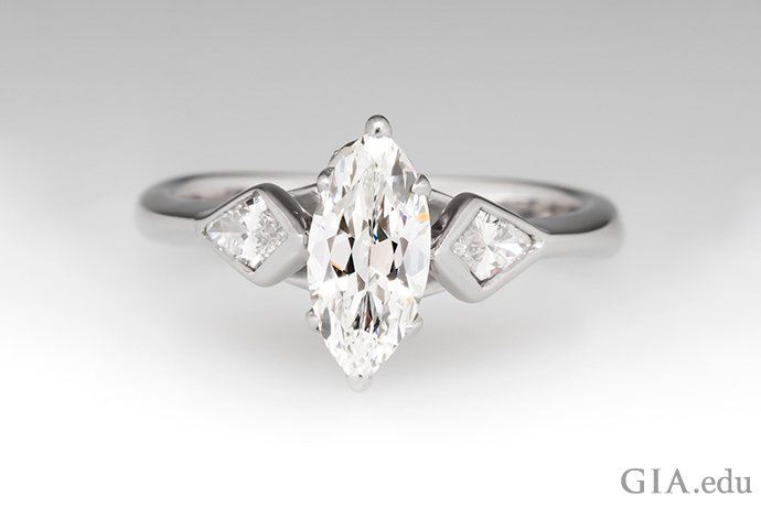 A G-color marquise diamond engagement ring set in white gold.