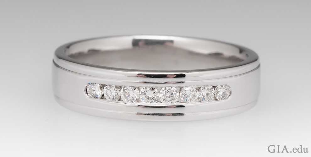 Mens wedding band with channel set diamonds.