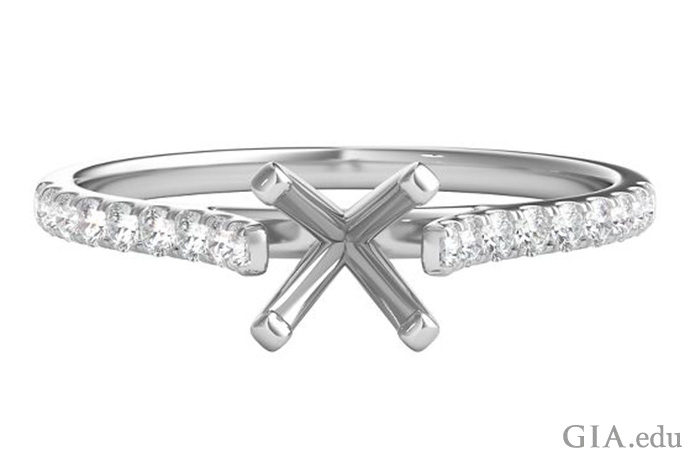 A four-prong head rises above a platinum shank set with diamond melee in this semi mount ring.