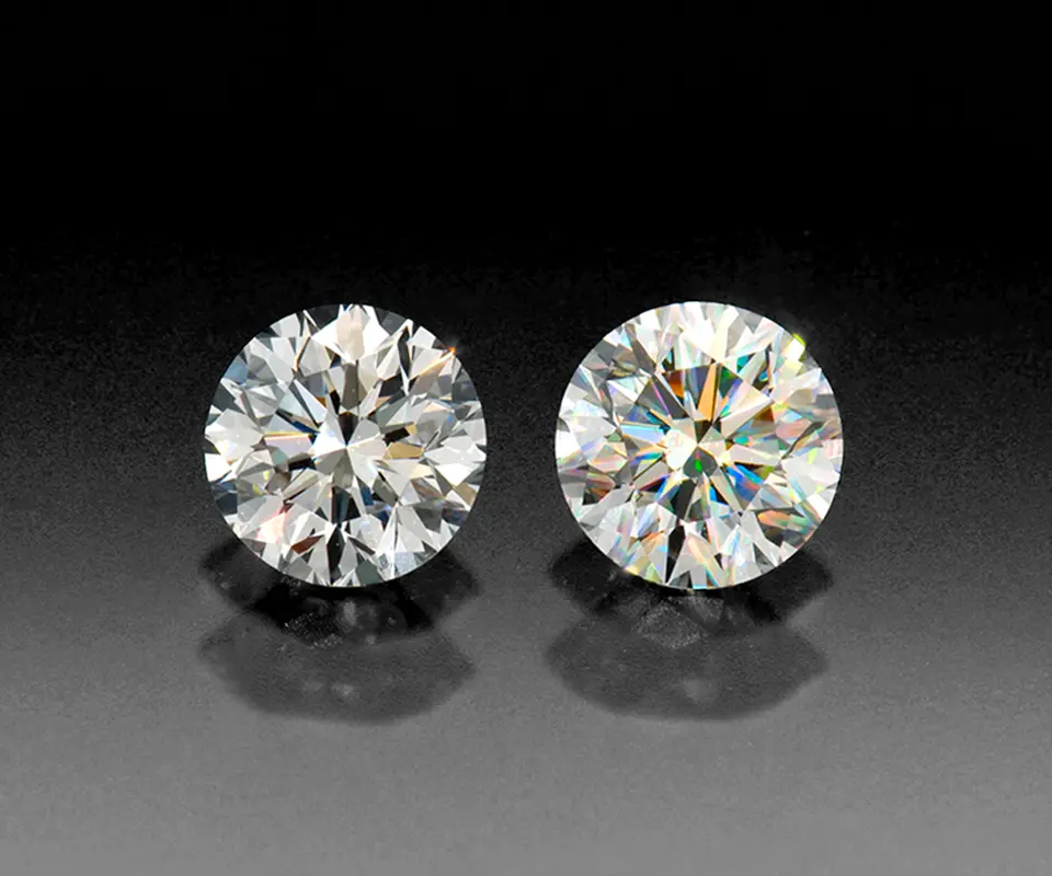 Round brilliant diamonds with different cut grades