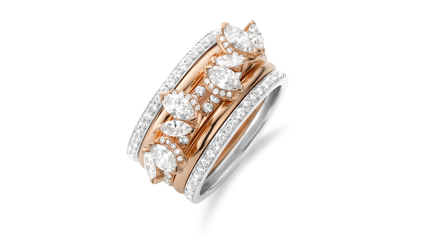Rose gold and white gold ring stack with diamonds.
