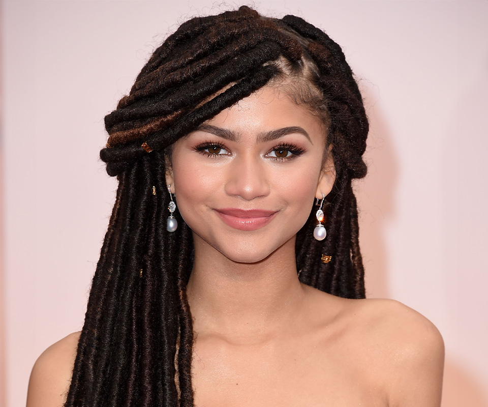 Zendaya wearing pearl and diamond drop earrings