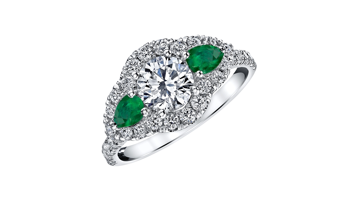 A three-stone diamond ring with a halo.