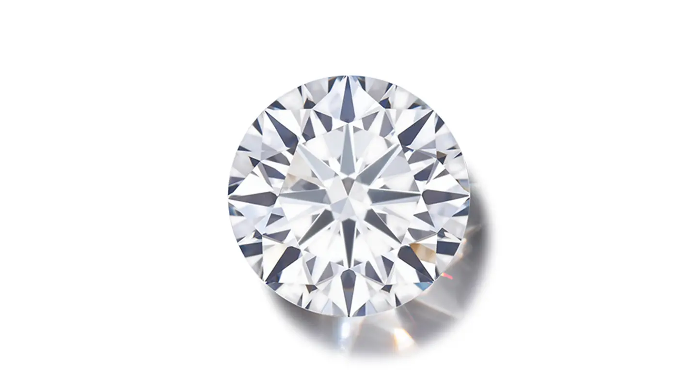 Round brilliant cut diamond on white background.