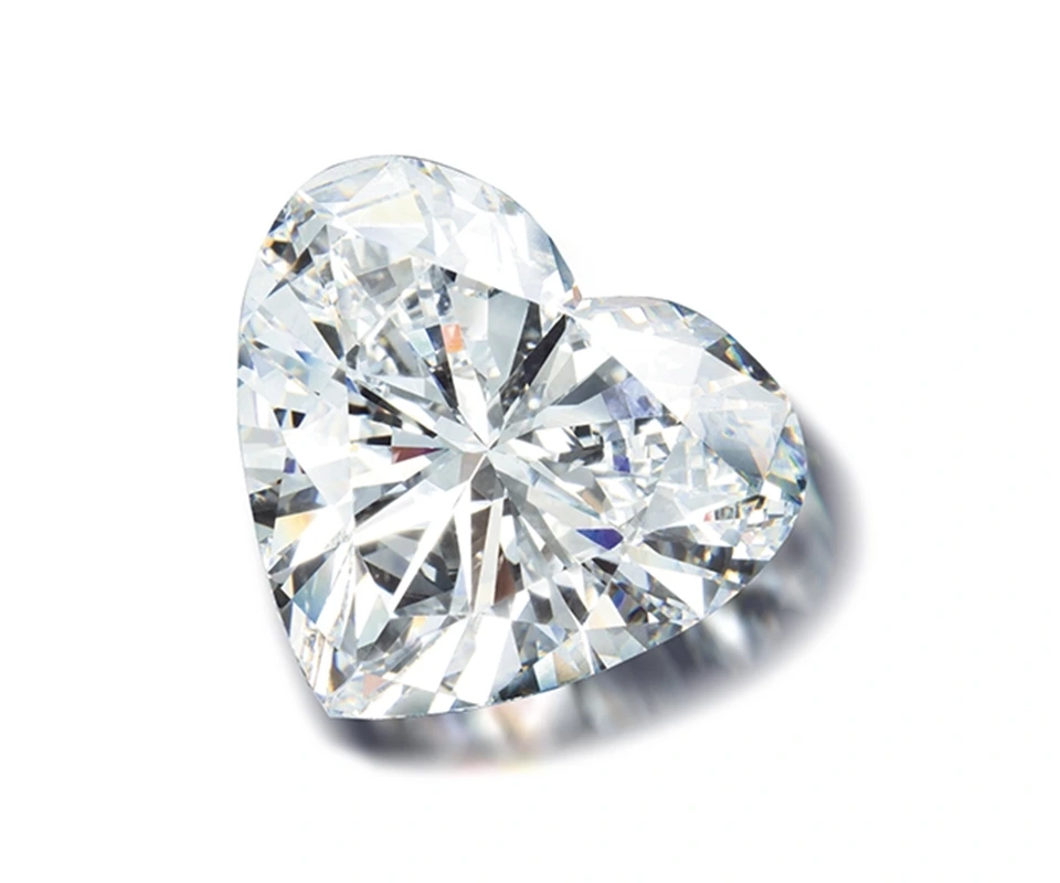 Heart-shaped diamond on white background
