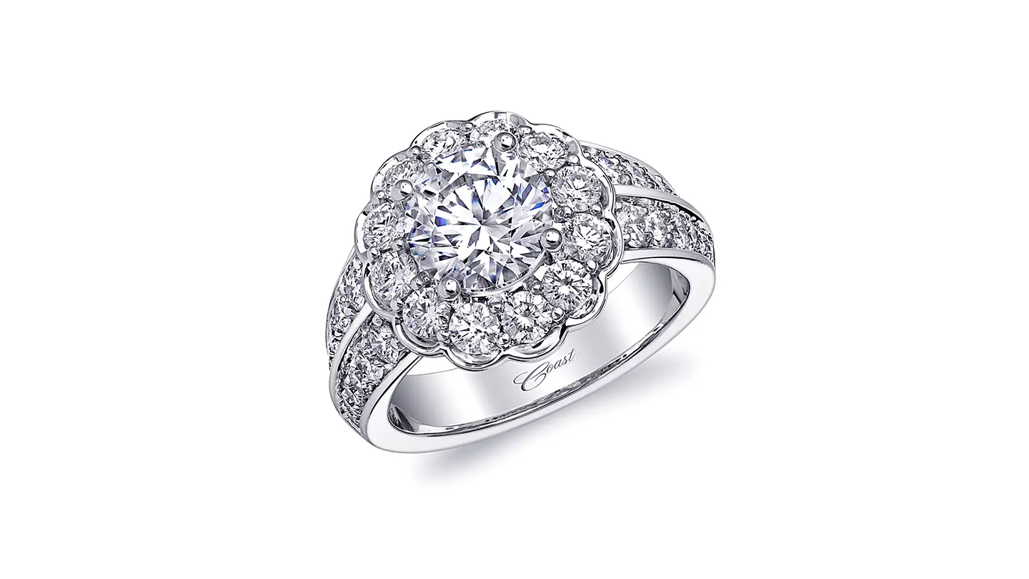 Platinum ring with cubic zirconia center stone surrounded by diamonds on white background
