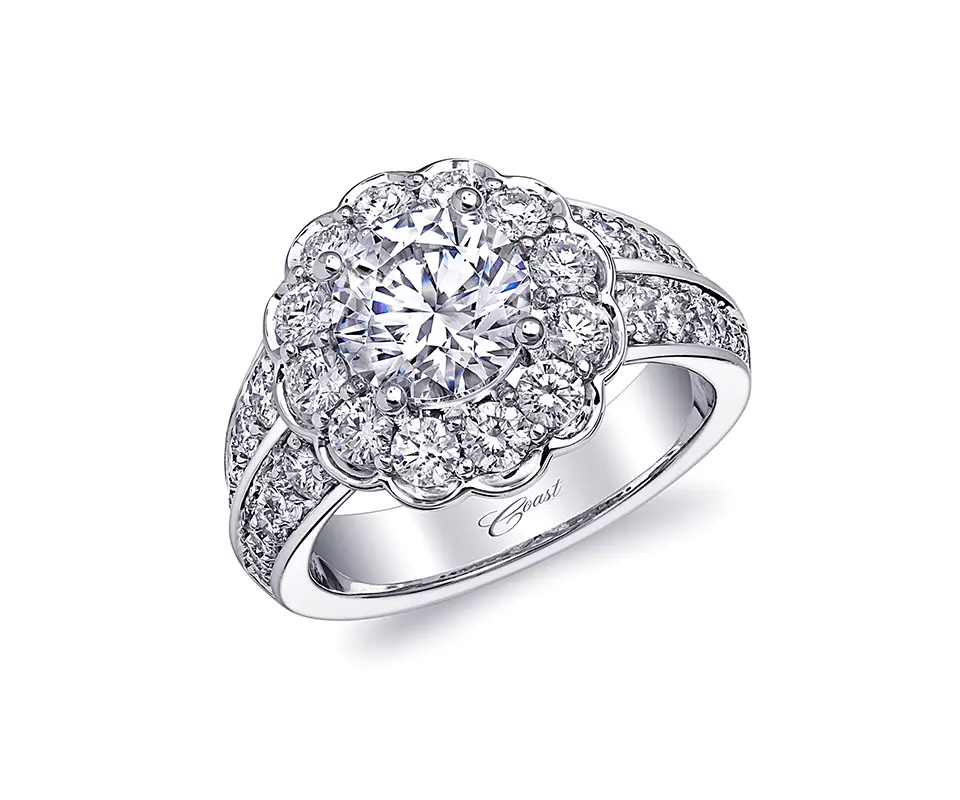 Platinum ring with cubic zirconia center stone surrounded by diamonds on white background