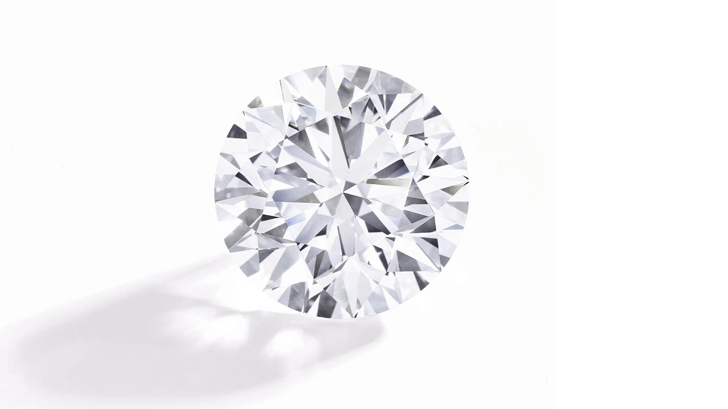 Loose round brilliant diamond with excellent cut grade on white background