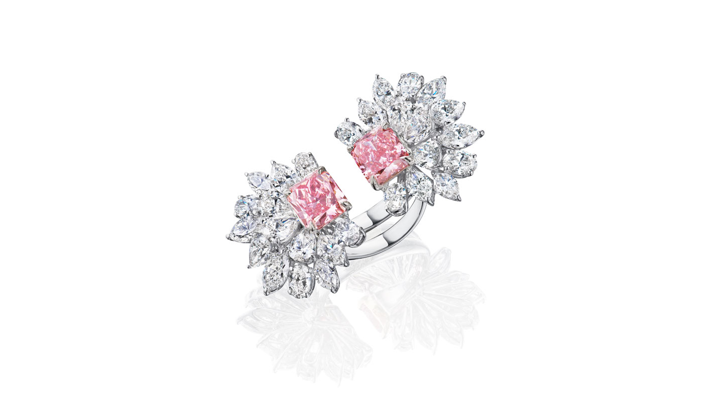 Open-style ring with two lab-grown pink diamonds surrounded by colorless diamonds resembling flower petals
