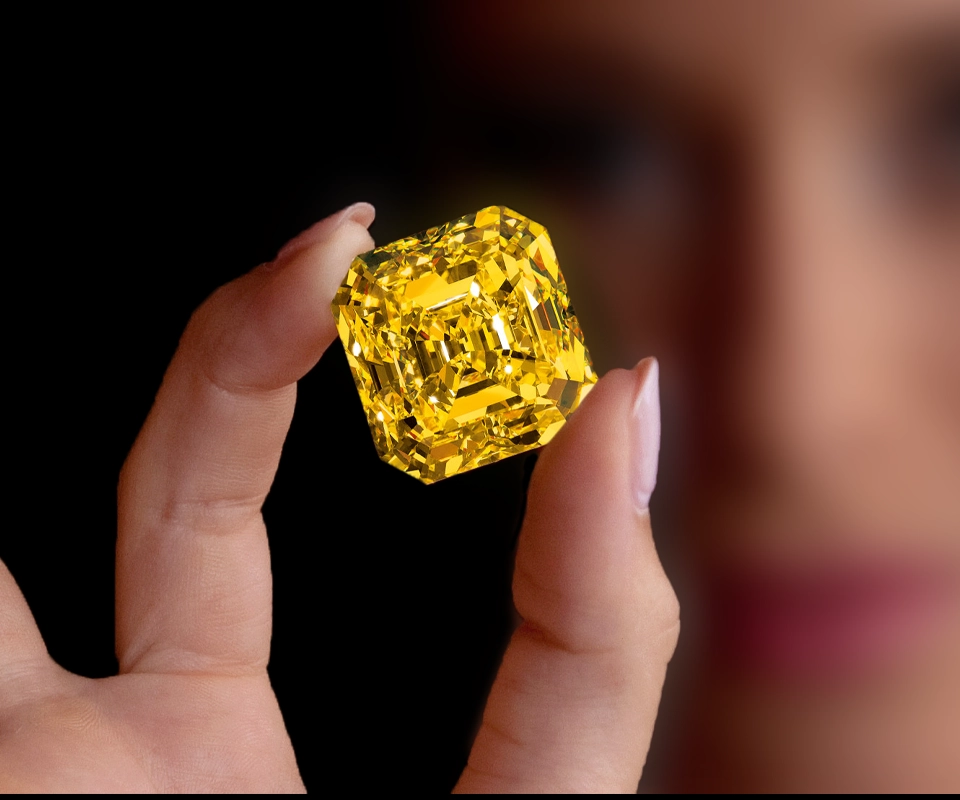 Delaire Sunrise, a Fancy Vivid Yellow square emerald‑cut diamond