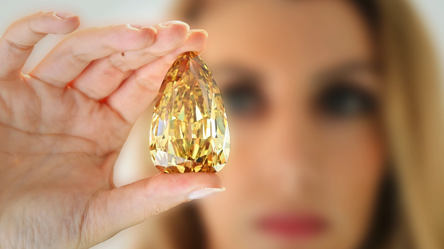 Golden Canary pear‑shaped Fancy Brownish Yellow diamond.