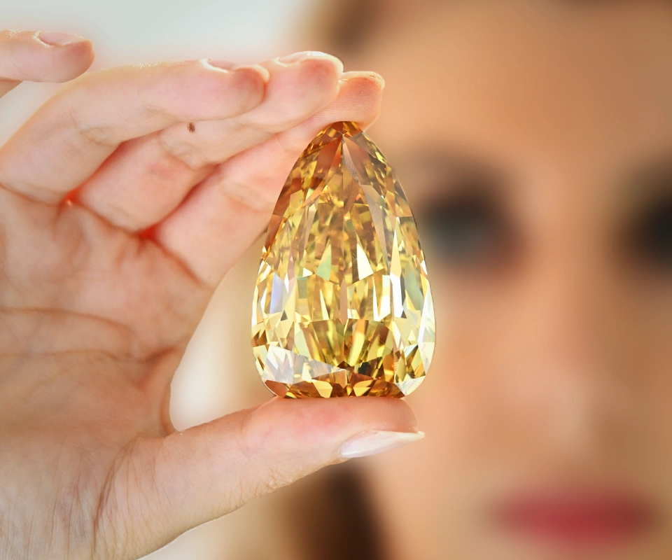 Golden Canary pear‑shaped Fancy Brownish Yellow diamond.