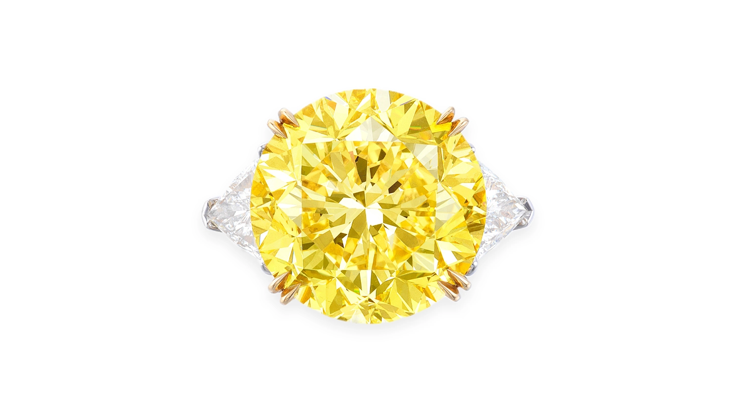 15-carat Fancy Vivid Yellow round brilliant diamond ring against a white background