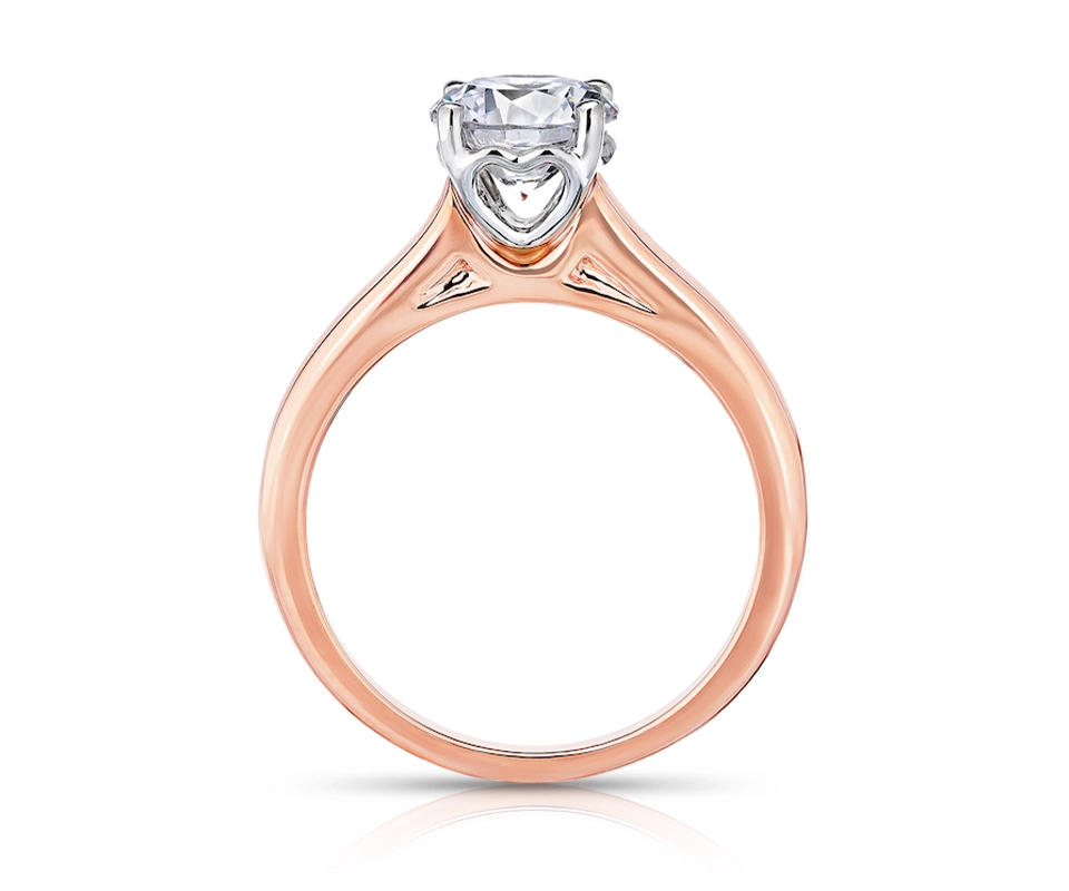Rose gold diamond engagement ring with heart-shaped, white gold basket setting