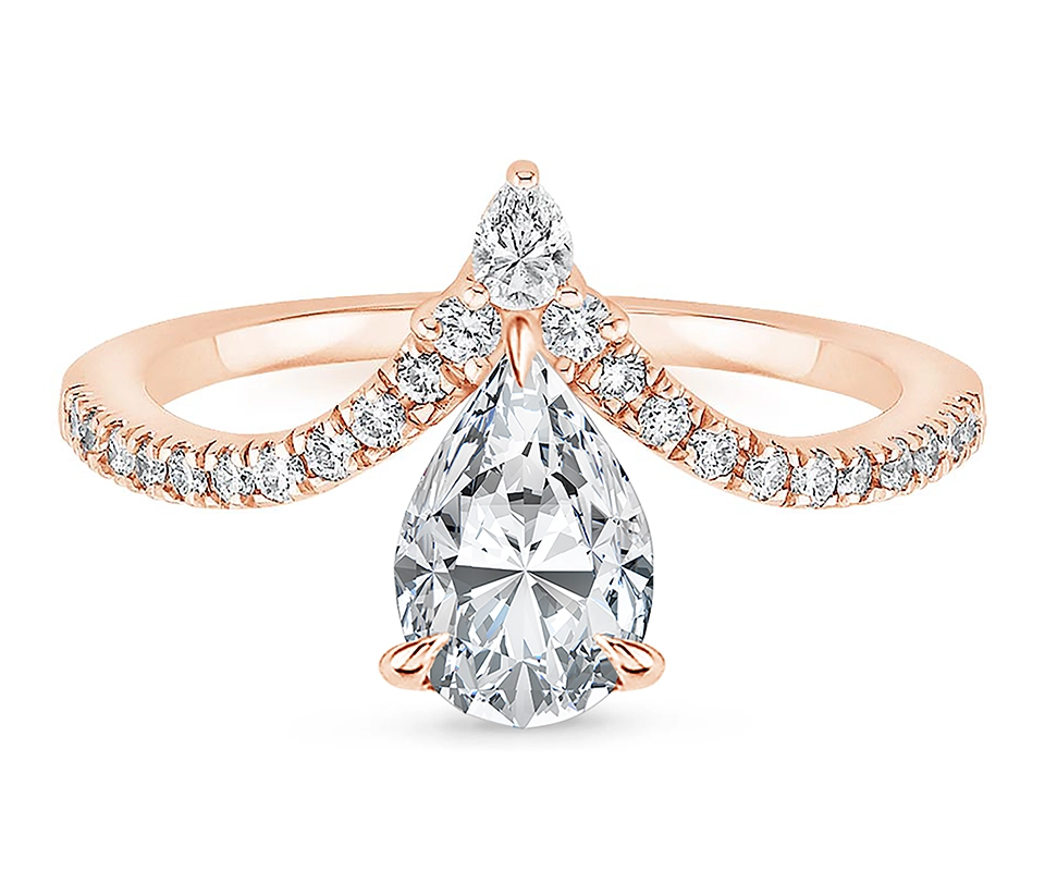 Ring with pear shaped diamond set in chevron shape pavé band