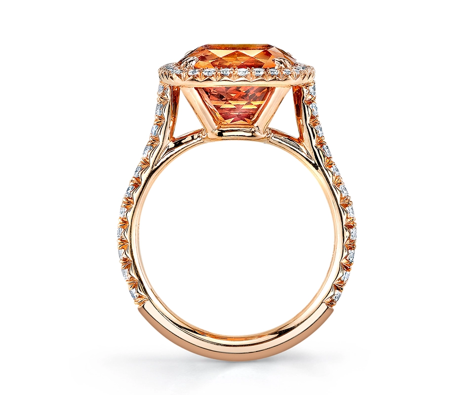 Cathedral set ring featuring orange spessartite garnet and pavé diamond band.