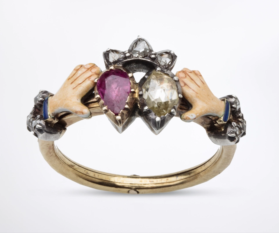 Antique gimmel ring with a ruby and diamond in collet cut down setting