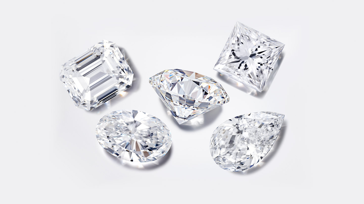 An oval, round, emerald cut and pear-shaped colorless diamond
