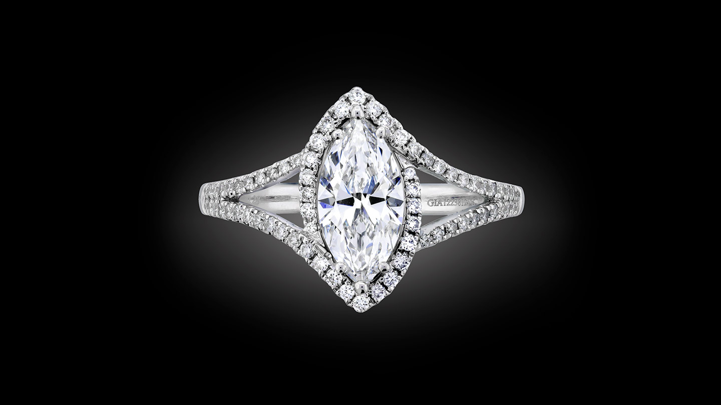 Marquise-cut diamond ring with halo and split-shank setting