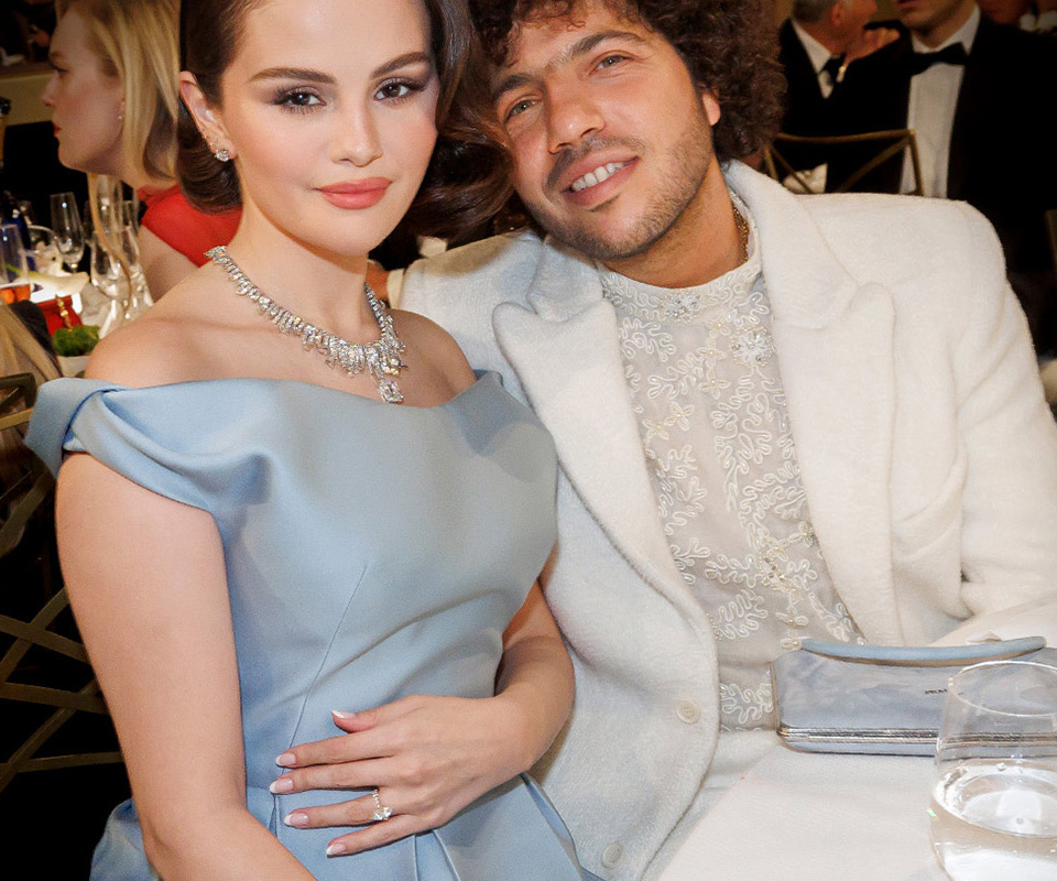 Selena Gomez wearing a marquise-cut diamond engagement ring on a pavé set yellow gold band at the Golden Globes